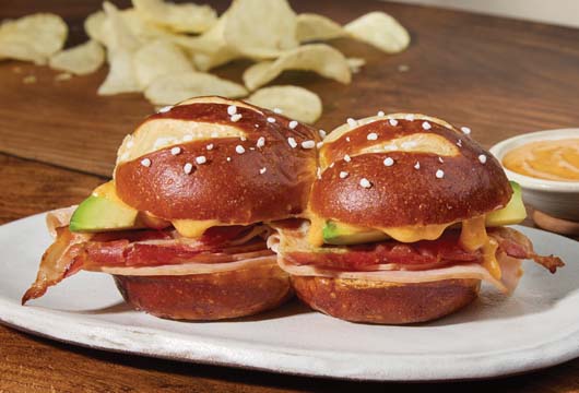 Pretzel Sliders with Smoked Turkey, Bacon, Avocado & Bistro Sauce